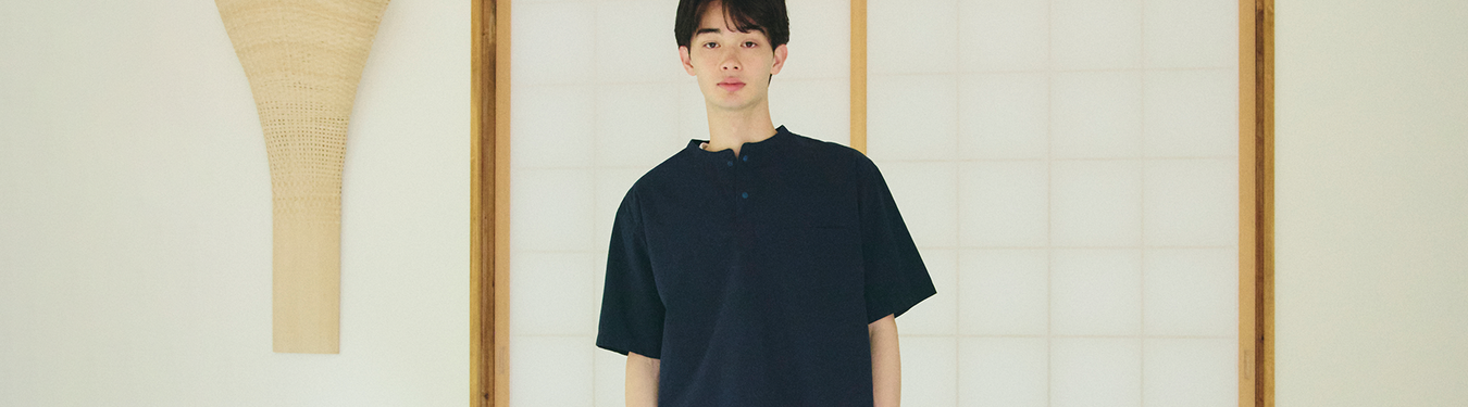 Men's Apparel; Man wearing a cool touch shirt indoors. 
