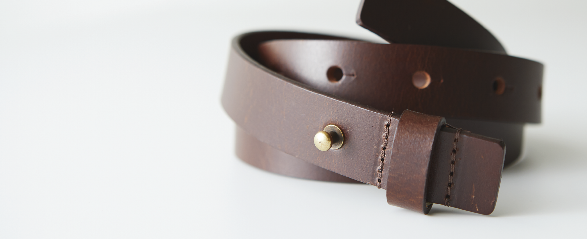 A rolled-up Brown Leather Belt 