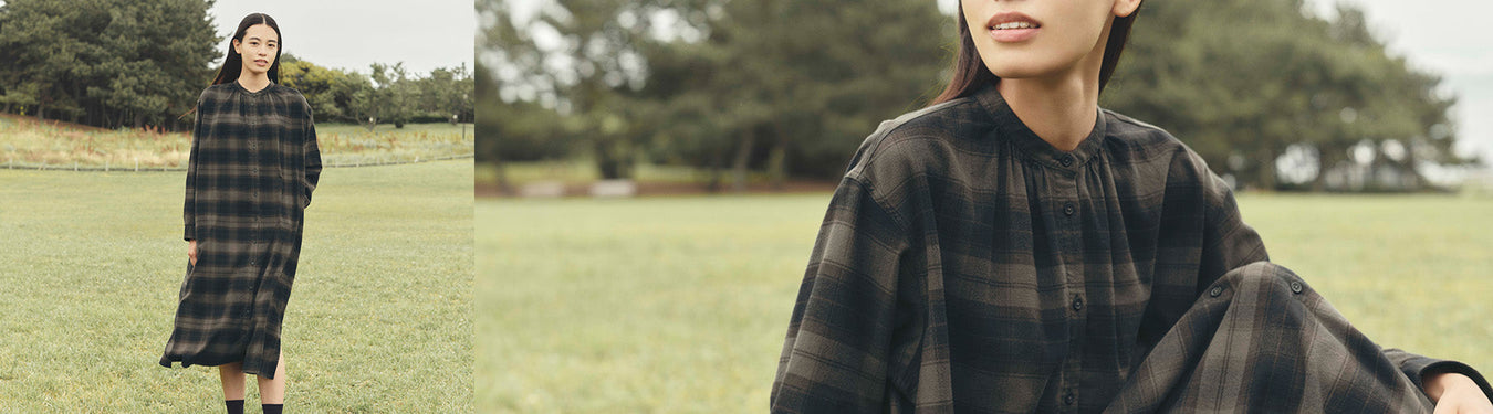 Women's dresses; Model wearing plaid flannel in outdoor setting.