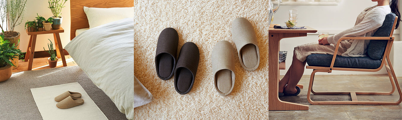 Bedroom with slippers on a mat; high pile rug with 2 slippers places side by side; woman sitting in chair wearing slippers