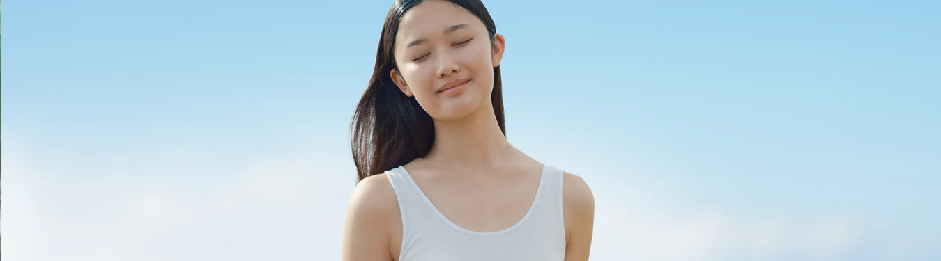 Women wearing a white tank top.