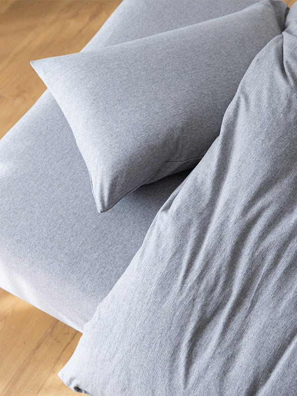 MUJI Bedding | Cotton & Linen, Women Asleep in an Off-White Comforter