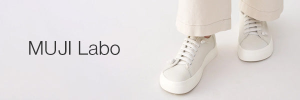 White low-top lace-up sneakers worn with light beige pants, shown against a clean white background with the text 'MUJI Labo' on the left.