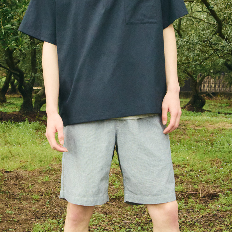 Man outdoors wearing shorts
