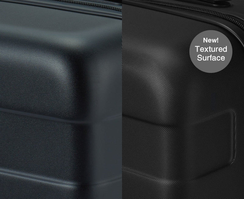 Black textured suitcase with a label indicating 'New! Textured Surface'.